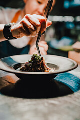 Chef decorate plate with food