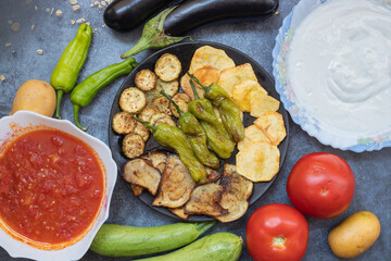 Traditional delicious Turkish food, fried mixed vegetables (potatoes, eggplant, zucchini, roasted peppers), Turkish name; mixed fried vegetables