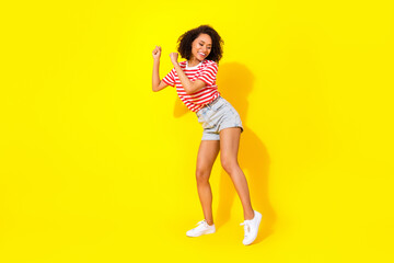 Fototapeta na wymiar Full size photo of young dancing funny woman after work chill vacation dance club isolated on yellow color background