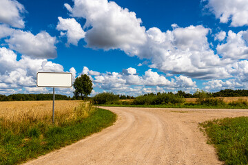 A country road splits in two, making a decision-requiring fork in the road © graja