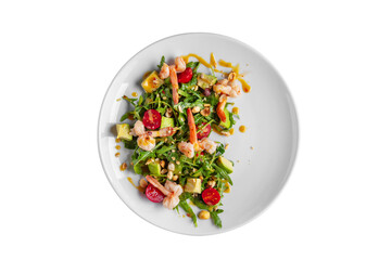 Salad with shrimps, avocado, arugula, tomatoes, sauce and hazelnuts