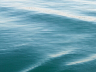 Calm sea surface waving texture.