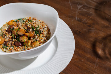 Porridge with wheat, mushrooms and herbs