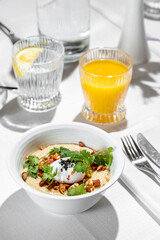Oatmeal with nuts and poached egg