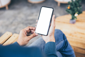 cell phone blank white screen mockup.hand holding texting using mobile on desk at office.background empty space for advertise.work people contact marketing business,technology
