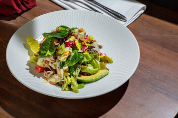 Salad with avocado, spaghetti, arugula, sorrel, pepper