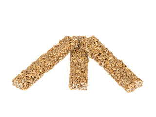 Three strips of sweet kozinaki dessert on a white background.