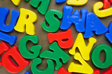 Fototapeta premium Alphabet on color background. School and education concept. Empty space for text and design
