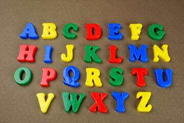 Alphabet on color background. School and education concept. Empty space for text and design