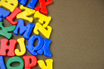 Fototapeta premium Alphabet on color background. School and education concept. Empty space for text and design