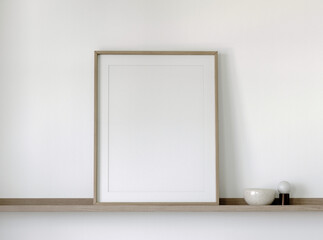 Wooden frame mockup close up on a wooden shelf with decor, 3d render