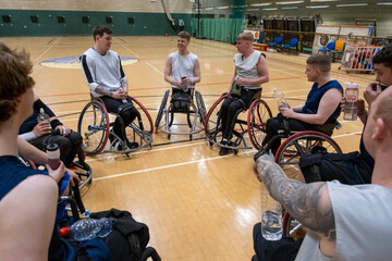 Men in wheelchairs at basketball practice