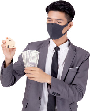 Young Asian Businessman In Face Mask Holding Money Dollar And Home Isolated Png Transparent File, Pandemic And Crisis Of Economic, Business Man And Investment Property During Disease Covid-19.