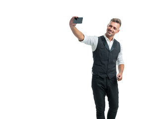 Happy professional guy in suit vest making videochat using smartphone isolated on white
