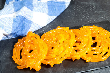 algeria sweet food named zlabi, in Inde named Jalebi, it is prepared with flour and yogurt and honey and other ingredients