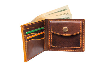 A man is holding an open brown wallet with money and credit cards