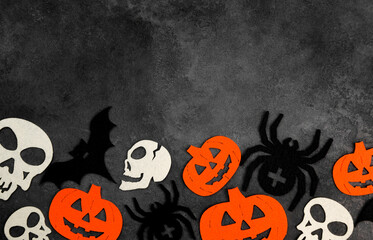 Halloween attributes on black background. October 31 concept.