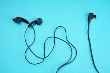 Top view of Mobile phone with headphones isolated on colorful background, Listen to music. Space for text