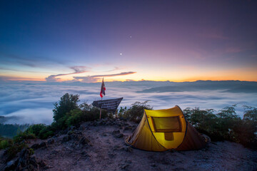 Sea of Mist, beautiful mist with the mountains during sunrise time Gunung Silipat peaks located in...