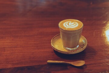 Glass of coffee on table.