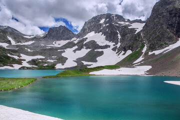 A beautiful alpine lake surrounded by mountains. Soft focus.