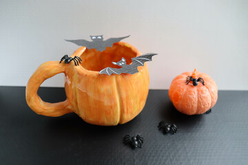 halloween background. original handmade soy candle made of natural soy wax in the shape of a...