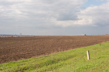 minimalistic landscape field plowed land green grass