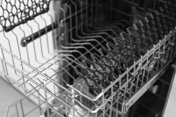 Dishwasher. Loading dishes. Dishwashing capsules. Open dishwasher with clean dishes in the white kitchen. Opening and closing the dishwasher.