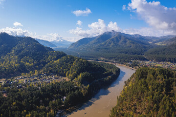 Beautiful sunrise landscape on river Katun Altai Russia. Mountains are covered with fog aerial top view