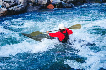 Banner whitewater kayaking, extreme water sport rafting. Man in kayak sails mountain river sunny day © Parilov