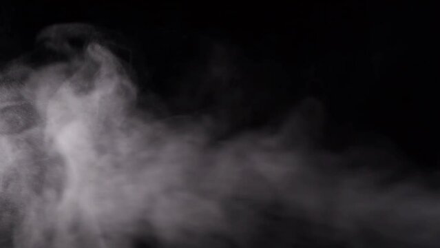 smoke steam or abstract white smog. on a black background