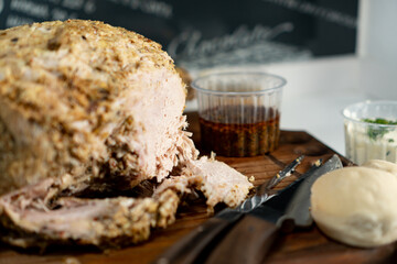 a cut paw of pork on a wooden table