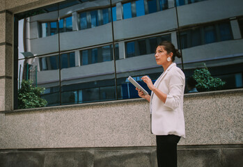 Business woman near the bank windows