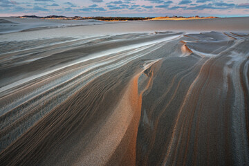 Winter landscape at sunrise of the Silver Lake Sand Dunes, Silver Lake State Park, Michigan, USA
