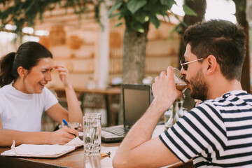 Laughing and drinking coffee