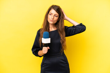 pretty caucasian woman smiling happily and daydreaming or doubting. tv presenter concept