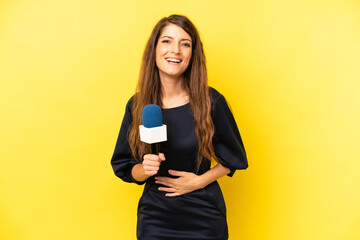 pretty caucasian woman laughing out loud at some hilarious joke. tv presenter concept