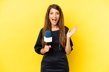 pretty caucasian woman feeling happy and astonished at something unbelievable. tv presenter concept
