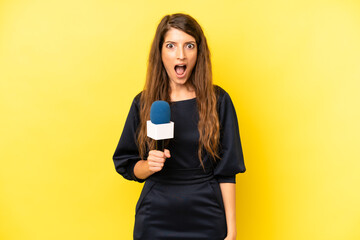 pretty caucasian woman looking very shocked or surprised. tv presenter concept