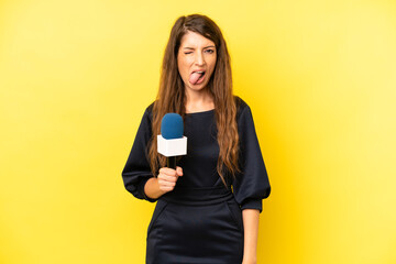 pretty caucasian woman with cheerful and rebellious attitude, joking and sticking tongue out. tv...