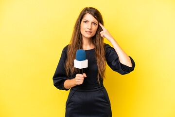 pretty caucasian woman feeling confused and puzzled, showing you are insane. tv presenter concept
