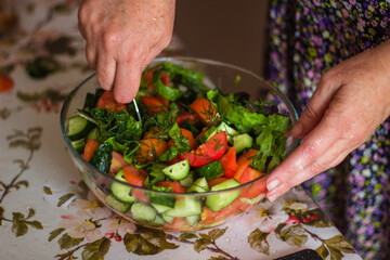person preparing salad