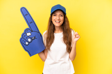 pretty caucasian woman feeling shocked,laughing and celebrating success. number one fan concept