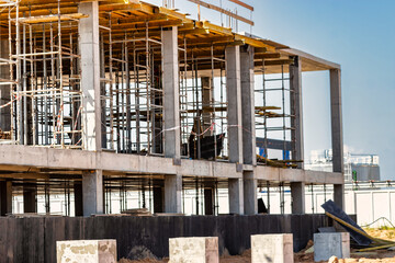 Formwork for pouring the second floor of a monolithic building. Reinforcement of walls and ceiling. Monolithic work during the construction of a building close-up. Construction technologies.