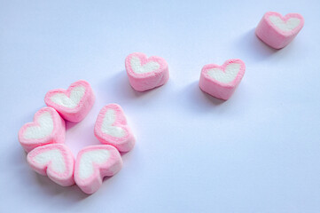 Rows of pink and white heart shaped marshmallow candies. Marshmallows in the shape of a heart on background. Valentine's day concept fill heart for full of love.