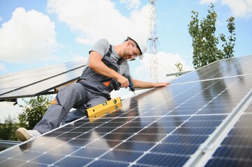A man working at solar power station.