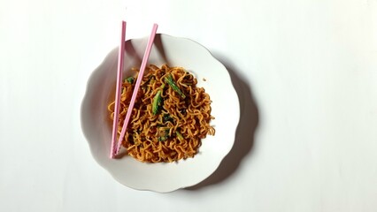 delicious noodles mixed with mustard greens with a white background