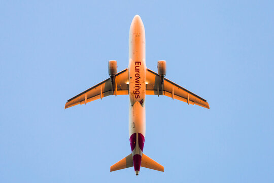 Eurowings Airbus A320 (A320-214 with CFM56-5B4 engines) takeoff in sunrise / airplane / plane; August 11, 2022
