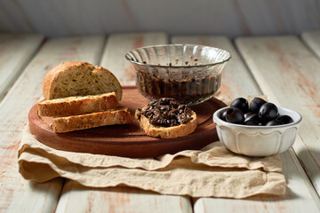 Tapenade, paste made from olives. Bowl with spreadable black