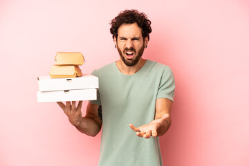crazy bearded man looking angry, annoyed and frustrated. fast food concept